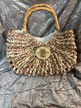 Handwoven Natural Straw Shoulder Bag with Bamboo Handles and Bee Medallion